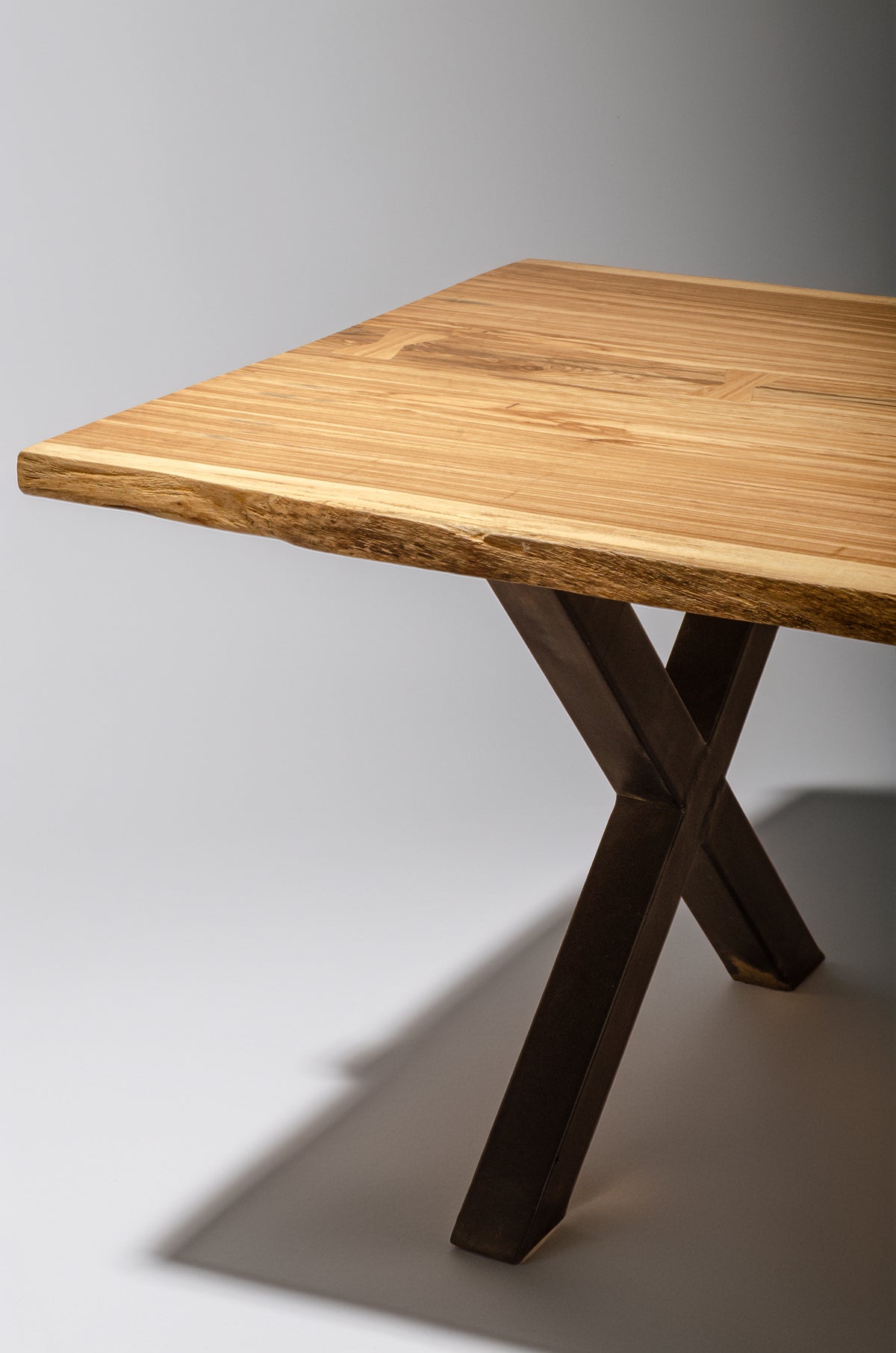 Beli single-trunk dining table with steel X-base, handcrafted by NAKA Furniture in Paarl (7 of 7)